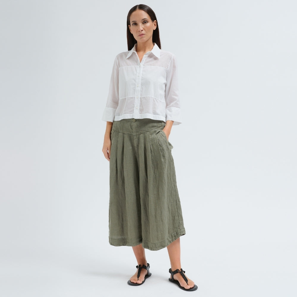 A boxy, cropped black shirt by Transit Par Such in stretch poplin with sheer panels, a pointed collar and three-quarter sleeves with wide cuffs - full model front view