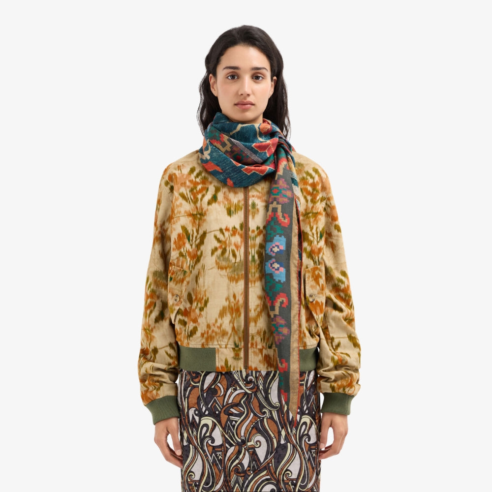 Riada Concept Pierre-Louis Mascia silk diamond scarf with red and orange florals on deep teal-blue and a gold-edged border. Made in Italy - styled model
