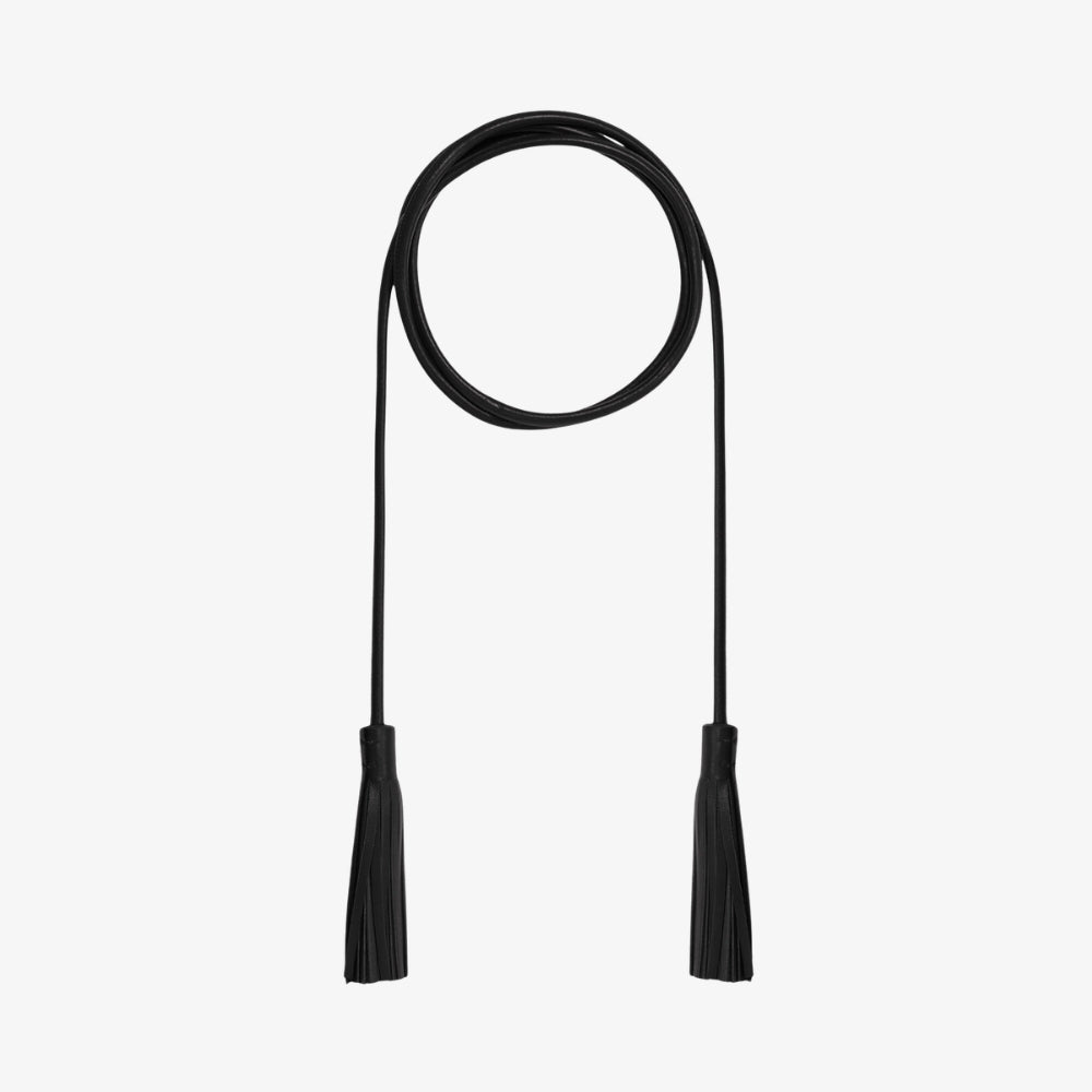 Riada Concept Pierre-Louis Mascia tassel belt in a deep near-black: a slender nappa lambskin cord that ties at the waist, finished with two leather tassels. Made in Italy