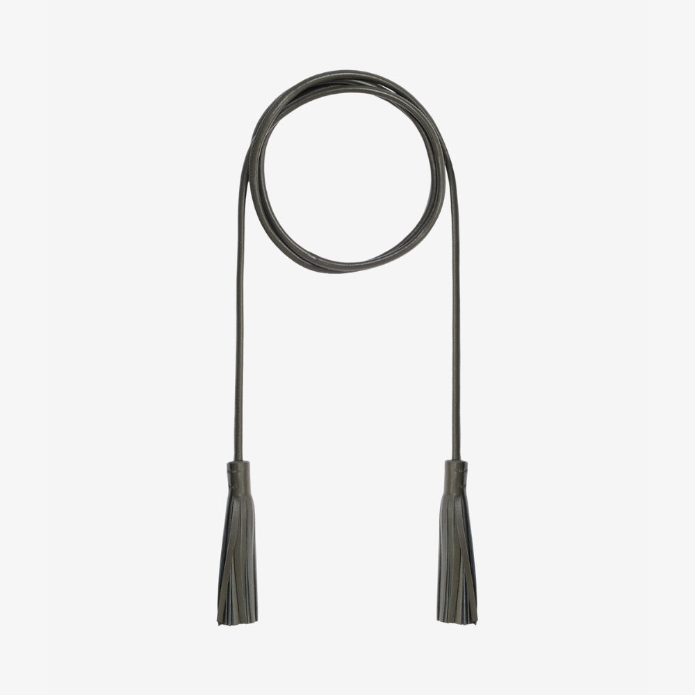 Riada Concept Pierre-Louis Mascia tassel belt in smoky olive: a slender nappa lambskin cord that ties at the waist, finished with two leather tassels. Made in Italy.