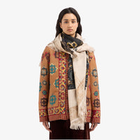 Riada Concept Pierre-Louis Mascia silk shawl printed with an antique black and gold embroidered gown on cream, with gold borders and a fringed edge. Made in Italy - styled model