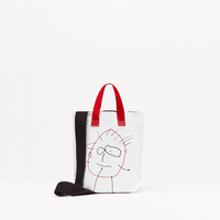 Plan C Optical White Pili & Bianca Mini Shopper back view with illustrated portrait and red handles