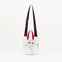 Plan C Pili & Bianca Mini Shopper Bag in Optical White with black graphic artwork, red handles and shoulder strap - front image full