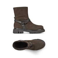 Brown suede boots with buckle detail on a white background