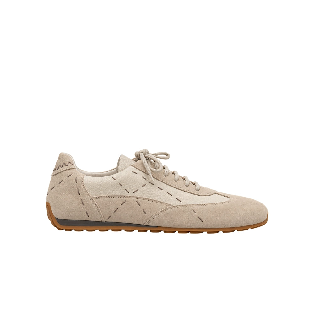 Riada Concept Off-white low-top sneakers by Henry Beguelin in chalky Gesso, mixing soft suede with grained leather and exposed stitching. Handcrafted in Italy - angle view