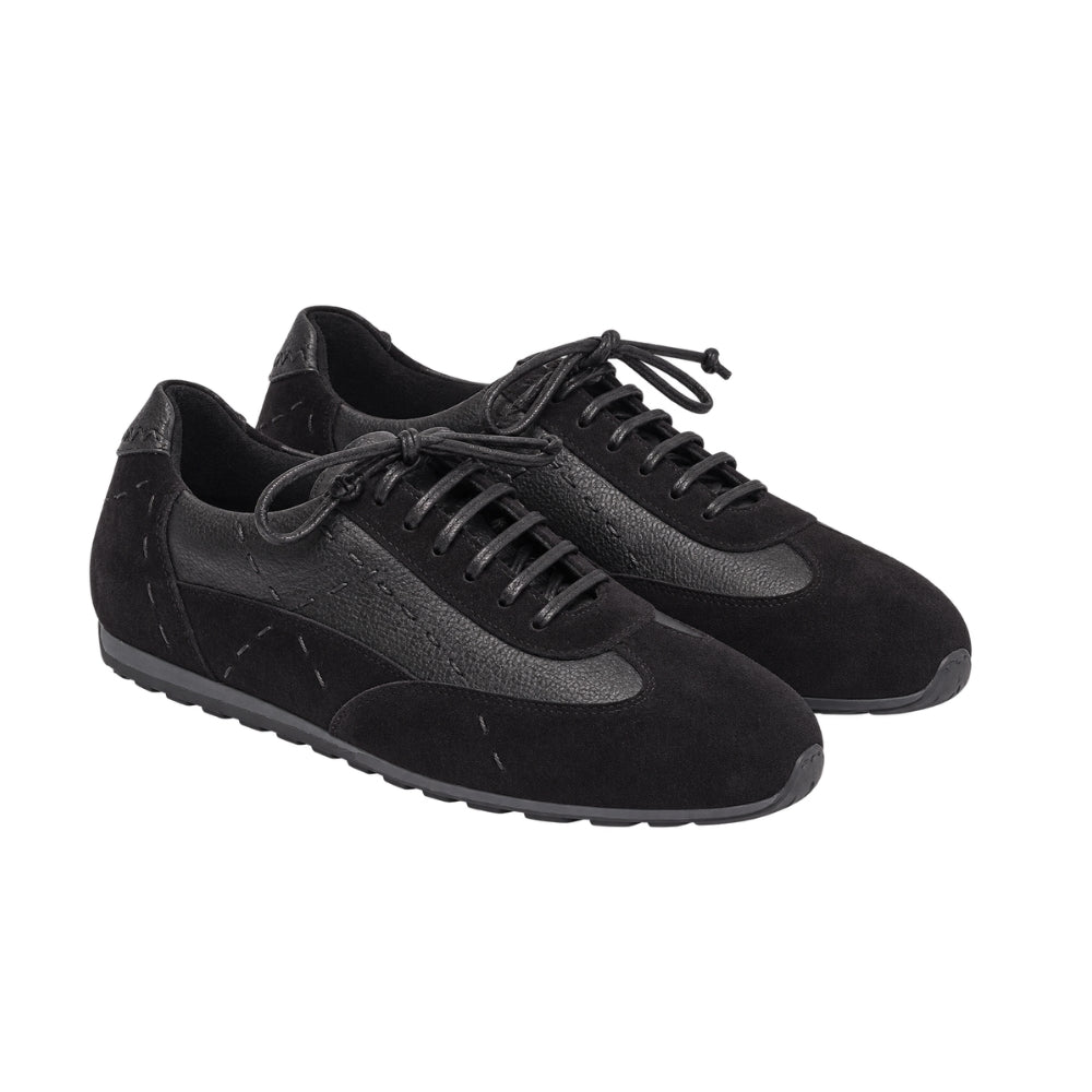 Riada Concept Black low-top sneakers by Henry Beguelin, pairing soft suede with grained leather, exposed stitching and a textured rubber sole. Handcrafted in Italy - angle view