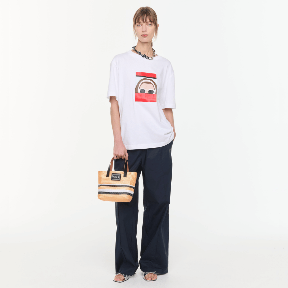 Plan C Self Portrait Print Cotton T-Shirt in Optical White with red graphic artwork styled with Plan C tote bag and black trousers