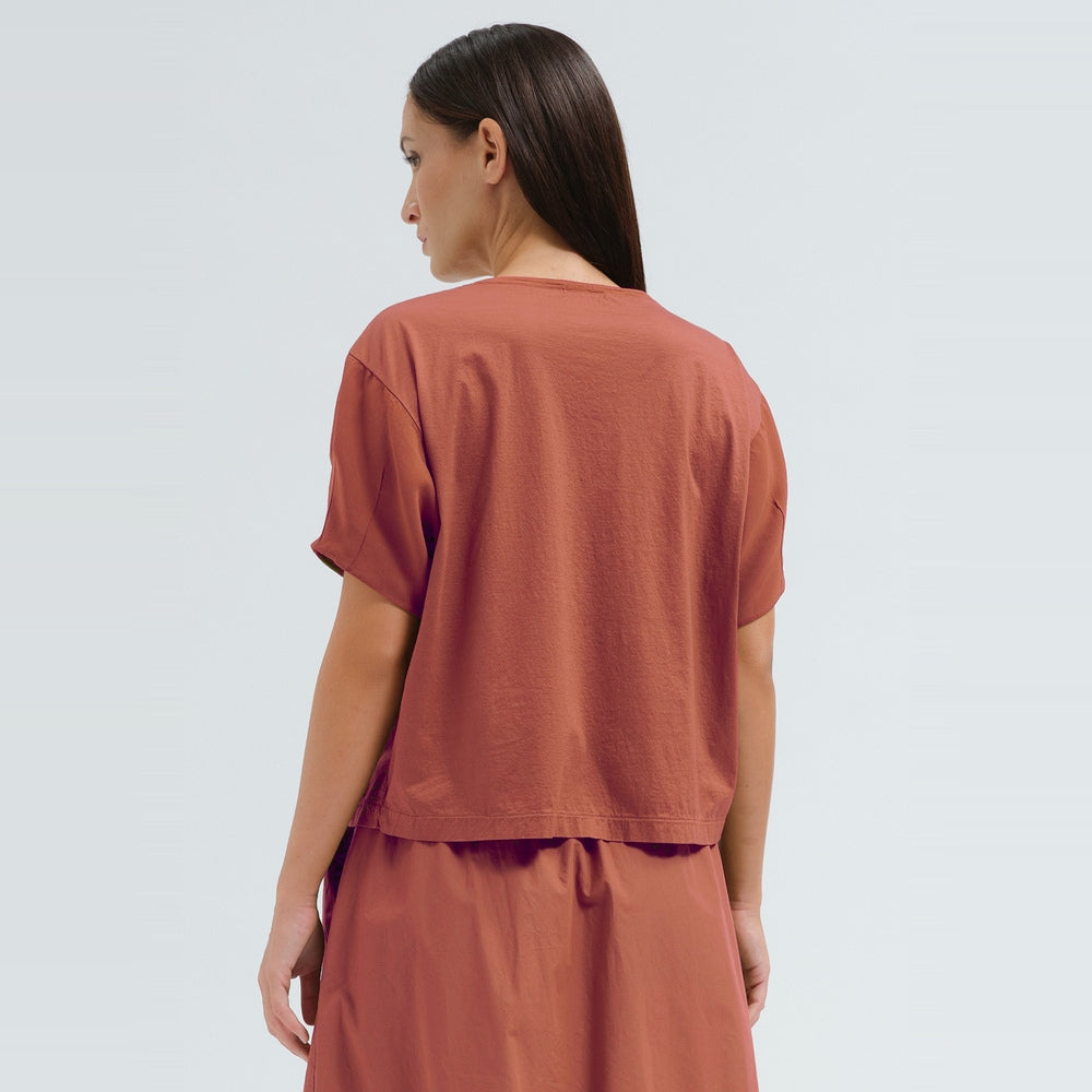 A sculptural, boxy T-shirt by Transit Par Such in brick cotton jersey, cropped to sit neatly at a high waist, with a round neck and short sleeves - back view