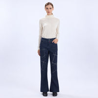 HIGH Everyday Couture Stardom bootcut jeans in deep blue denim with off-white geometric embroidery, front view
