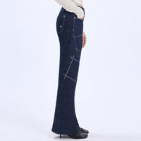 HIGH Everyday Couture Stardom bootcut jeans in deep blue denim with off-white geometric embroidery, side view