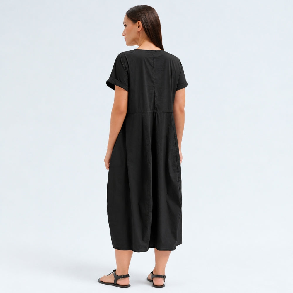 A below-the-knee V-neck dress by Transit Par Such in black stretch cotton, with a high-cut waist, cuffed short sleeves and side pockets - back view