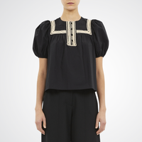 Ulla Johnson Lia Puff Sleeve Top in Noir - sculpted short puff sleeve top with lace trim. Available instore and online at Riada Concept, Woollahra — Sydney’s destination for a curated selection of international luxury brands