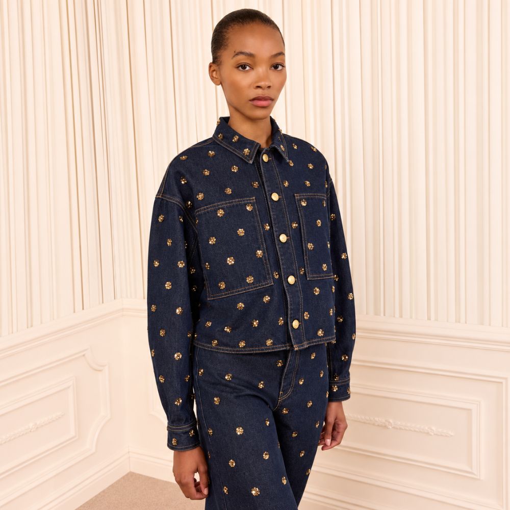 Riada Concept Ulla Johnson Bobbi dark indigo denim jacket embellished with gold sequinned flowers and gold-tone buttons - styled model front view