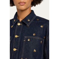 Riada Concept Ulla Johnson Bobbi dark indigo denim jacket embellished with gold sequinned flowers and gold-tone buttons - model view close-up