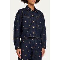 Riada Concept Ulla Johnson Bobbi dark indigo denim jacket embellished with gold sequinned flowers and gold-tone buttons - side model view
