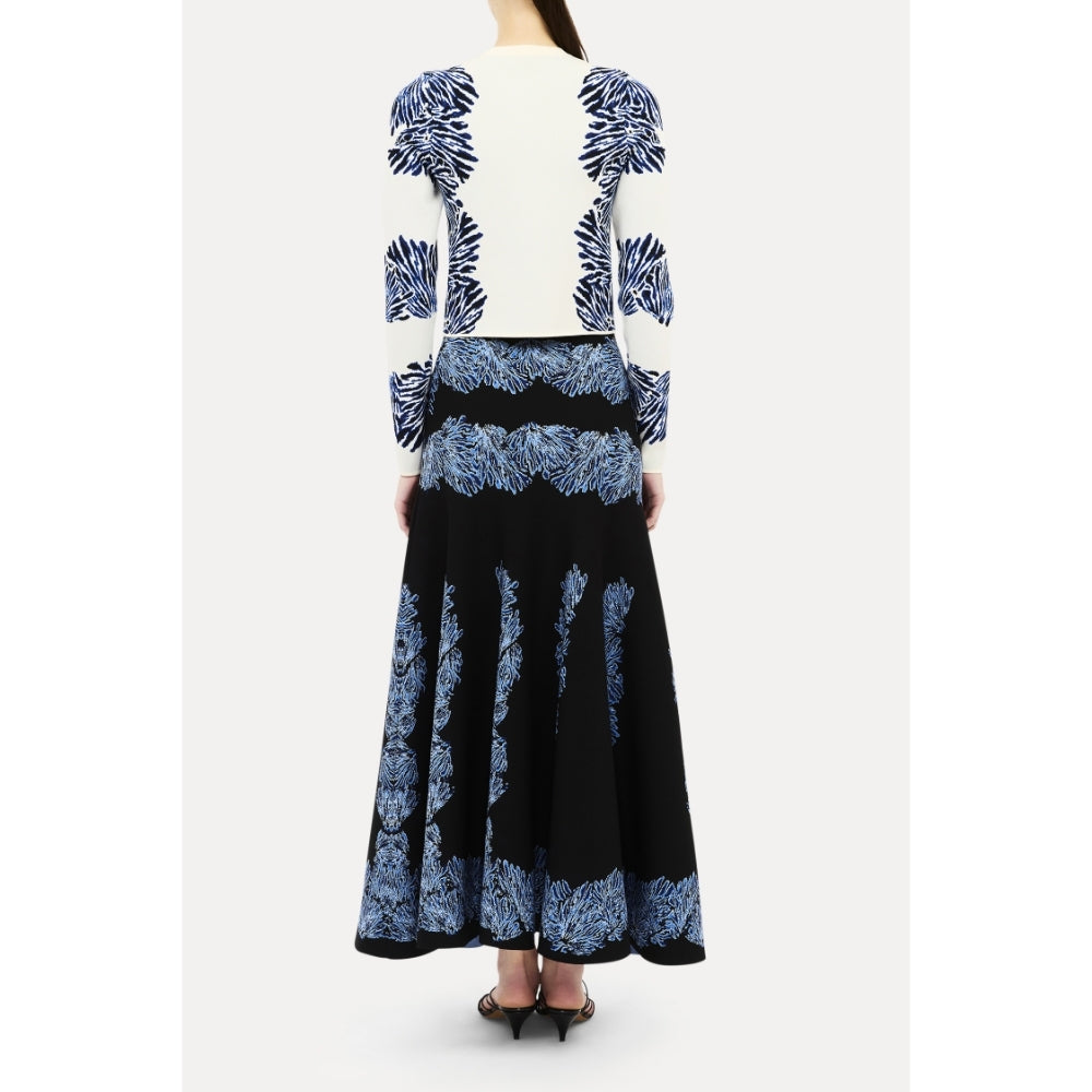Shop Ulla Johnson Carina in Ocean, a blue seashell jacquard knit cardigan with round neck, long sleeves and button front. Available at Riada Australia.