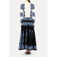 Shop Ulla Johnson Carina in Ocean, a blue seashell jacquard knit cardigan with round neck, long sleeves and button front. Available at Riada Australia.