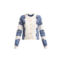 Shop Ulla Johnson Carina in Ocean, a blue seashell jacquard knit cardigan with round neck, long sleeves and button front. Available at Riada Australia.
