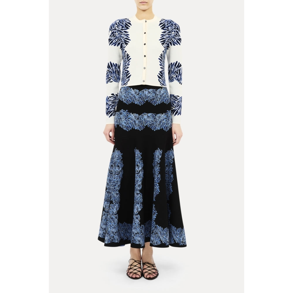 Shop Ulla Johnson Carina in Ocean, a blue seashell jacquard knit cardigan with round neck, long sleeves and button front. Available at Riada Australia.