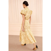 Riada Concept Ulla Johnson Clarisse high-waisted cotton poplin trumpet midi skirt in a pale yellow print - angle view