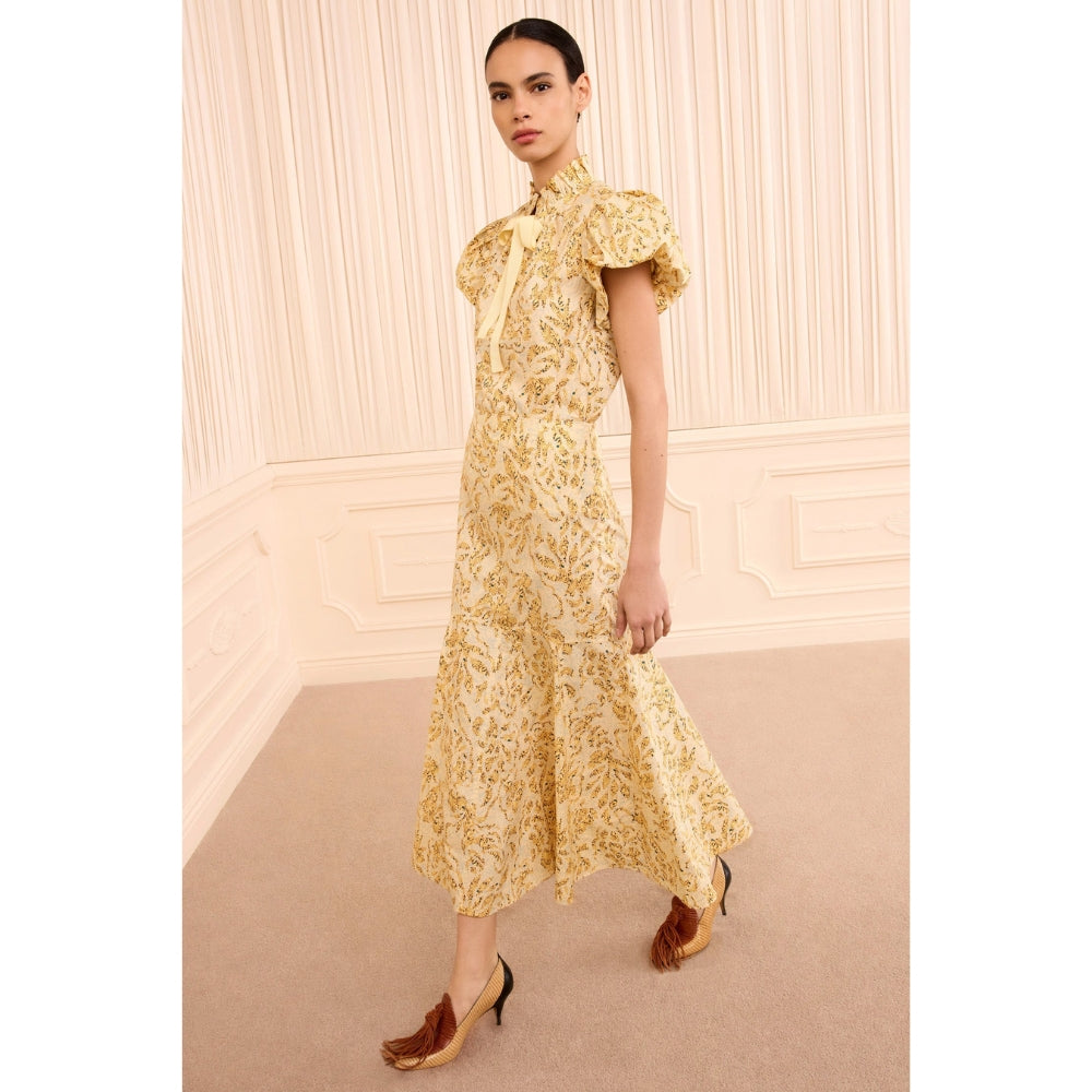 Riada Concept Ulla Johnson Clarisse high-waisted cotton poplin trumpet midi skirt in a pale yellow print - angle view