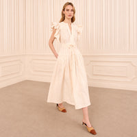 Riada Concept Ulla Johnson Dani ivory cotton poplin midi dress with eyelet embroidery, flutter sleeves and a belted waist - styled model view