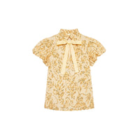 Riada Concept Ulla Johnson Estela cotton poplin top in a pale yellow print, with bubble sleeves and a ruffled tie neck