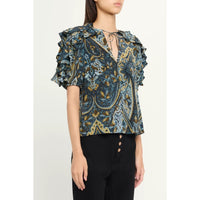 Riada Concept Ulla Johnson Josephine silk crepe de chine top in a blue paisley print, with ruffled sleeves and a tie neck - angle view