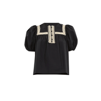 Ulla Johnson Lia Puff Sleeve Top in Noir - sculpted short puff sleeve top with lace trim. Available instore and online at Riada Concept, Woollahra — Sydney’s destination for a curated selection of international luxury brands