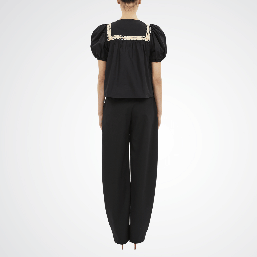 Ulla Johnson Lia Puff Sleeve Top in Noir - sculpted short puff sleeve top with lace trim. Available instore and online at Riada Concept, Woollahra — Sydney’s destination for a curated selection of international luxury brands