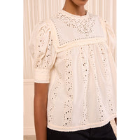 Riada Concept Ulla Johnson Una ivory cotton poplin top with eyelet embroidery, an embroidered yoke and puff sleeves - model close-up detail view