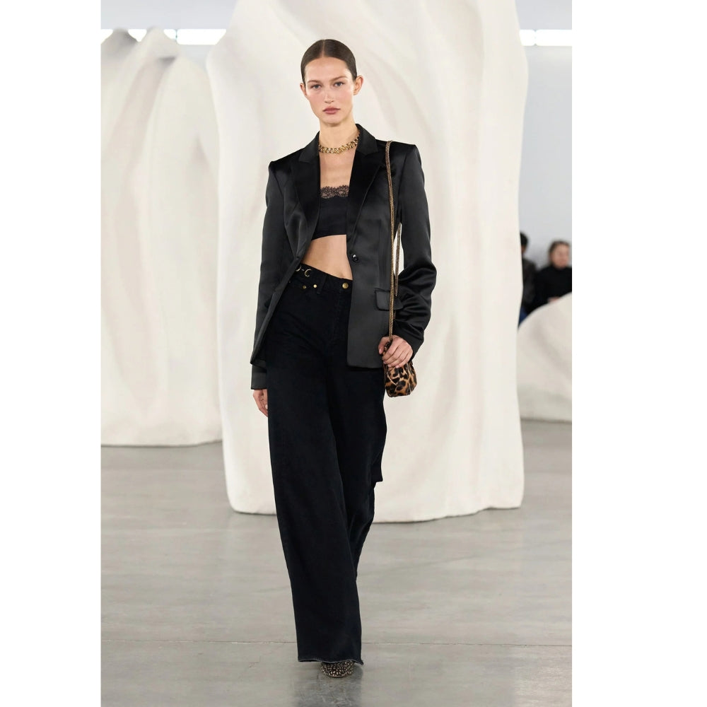 Ulla Johnson Valory high-rise flare jeans in black stretch denim with gold horsebit hardware. Shop at Riada Concept, shipping Australia-wide and worldwide.