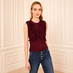 Riada Concept Ulla Johnson Vesna sleeveless wool jersey top in deep red, with ruffles tracing the bodice - styled model