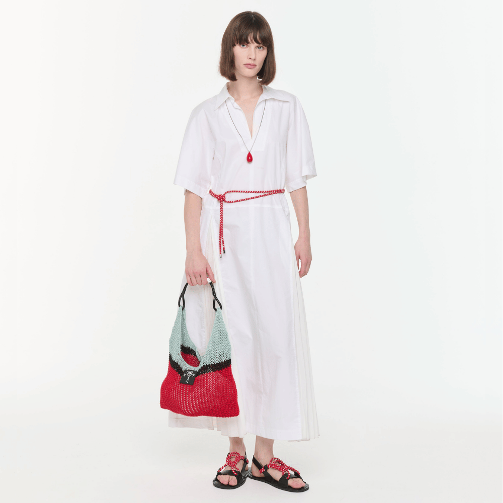 Plan C Optical White pleated shirt dress styled with Vermilion Red necklace and cord sandals