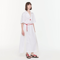 Plan C Optical White pleated shirt dress styled with Vermilion Red necklace and cord sandals - angled view