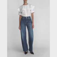 FRAME The Bow Jeans in Acumen New Fray at Riada Concept. High-rise rigid denim with a sculpted barrel leg and raw frayed hem - styled model video