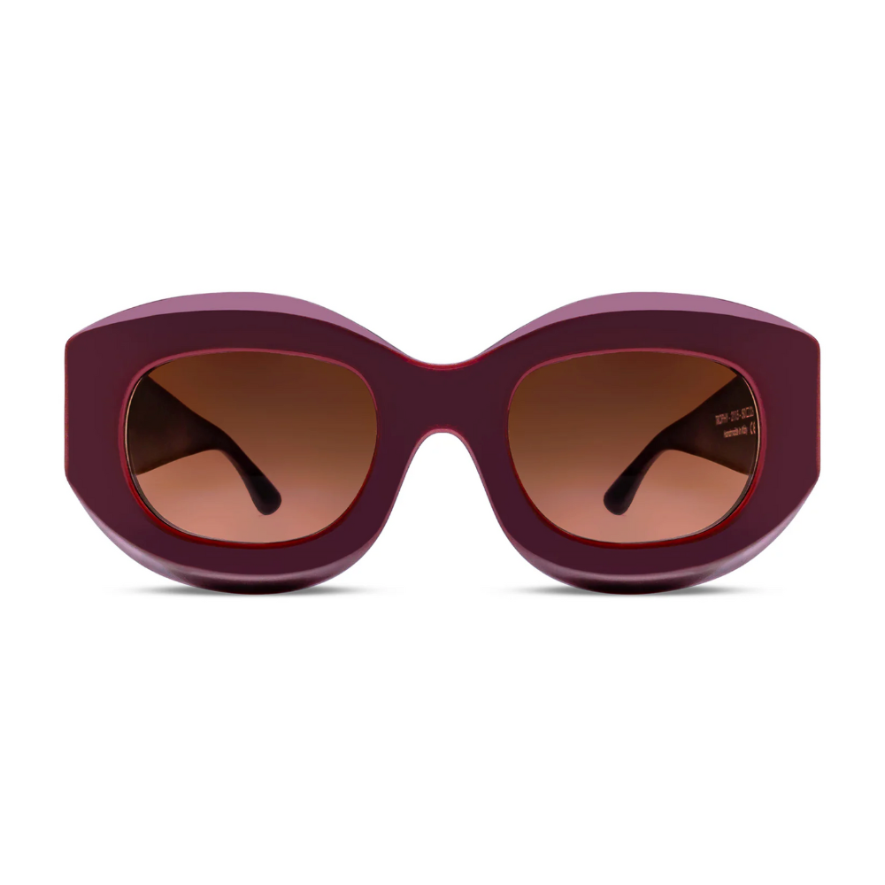 THIERRY LASRY Maroon sunglasses with brown lenses on a white background
